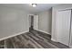 Bright bedroom features wood-look floors, closet, and a freshly painted neutral color at 511 Commonwealth St, Durham, NC 27703