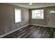 Living room with plenty of natural light through the windows and durable, stylish wood-look floors at 511 Commonwealth St, Durham, NC 27703