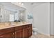 Bathroom featuring a double sink vanity, with decorative accents and a tile floor at 518 Emerald Downs Rd, Cary, NC 27519