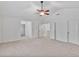 A bright bedroom with neutral carpet and a ceiling fan at 518 Emerald Downs Rd, Cary, NC 27519