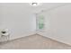 Bright bedroom with a window and carpeted floor at 518 Emerald Downs Rd, Cary, NC 27519