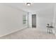 Bedroom featuring a window, neutral carpet, and a closet at 518 Emerald Downs Rd, Cary, NC 27519