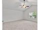 Bright and airy bedroom with vaulted ceiling, ceiling fan, and large window at 518 Emerald Downs Rd, Cary, NC 27519