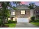Charming brick home with a two-car garage and a well-manicured front yard at 518 Emerald Downs Rd, Cary, NC 27519