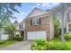 Charming brick home with a two-car garage and a well-manicured front yard at 518 Emerald Downs Rd, Cary, NC 27519