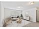 Inviting living room with neutral palette, modern furniture, and lots of natural light at 518 Emerald Downs Rd, Cary, NC 27519