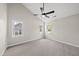 Bedroom with vaulted ceiling, neutral walls, carpeted floors, ceiling fan and windows at 5317 Peacenest Dr, Raleigh, NC 27610