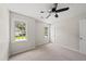 Bedroom with neutral walls, carpeted floors, ceiling fan and windows at 5317 Peacenest Dr, Raleigh, NC 27610