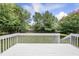 Spacious, white deck with bright sky and trees, great for entertaining and relaxing at 5317 Peacenest Dr, Raleigh, NC 27610