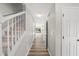 Hallway with wood floors and stairs leads to deck at 5317 Peacenest Dr, Raleigh, NC 27610
