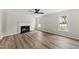 Living room with fireplace and multiple windows at 5317 Peacenest Dr, Raleigh, NC 27610