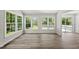Sun room with multiple windows and wood floors at 5317 Peacenest Dr, Raleigh, NC 27610