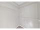 Walk-in closet with white shelving and neutral carpet at 5317 Peacenest Dr, Raleigh, NC 27610