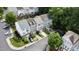 Aerial view of a community with townhomes, mature trees, and well-maintained landscaping at 5505 Heather Garden Way, Raleigh, NC 27613
