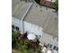 Aerial view of a backyard with a deck, patio furniture, and well-maintained landscaping at 5505 Heather Garden Way, Raleigh, NC 27613