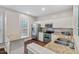 Bright eat-in kitchen boasts stainless steel appliances, granite countertops, white cabinetry, and wood-look floors at 5505 Heather Garden Way, Raleigh, NC 27613