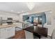 Open floor plan features an eat-in kitchen with stainless steel appliances, granite countertops and an adjacent dining area at 5505 Heather Garden Way, Raleigh, NC 27613
