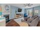 Comfortable living room featuring a fireplace, a TV, and a cozy seating arrangement, perfect for relaxation at 5505 Heather Garden Way, Raleigh, NC 27613