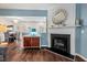 Living room showcasing fireplace, and open access to the dining area and kitchen at 5505 Heather Garden Way, Raleigh, NC 27613
