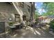 A charming brick home with a backyard patio featuring a sink and outdoor seating at 5523 Newberry Dr, Raleigh, NC 27609