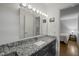 Bathroom showcasing granite countertop vanity, updated lighting, and medicine cabinet at 5523 Newberry Dr, Raleigh, NC 27609