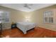 Bedroom featuring hardwood floors, neutral walls, and multiple windows for plenty of natural light at 5523 Newberry Dr, Raleigh, NC 27609