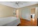 Bedroom with hardwood floors, neutral walls, ceiling fan, and ample closet space at 5523 Newberry Dr, Raleigh, NC 27609