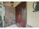 Inviting front entrance featuring double doors with brass hardware and a charming pineapple welcome sign at 5523 Newberry Dr, Raleigh, NC 27609