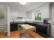 Charming kitchen features updated cabinets, hardware, countertops, stainless appliances and kitchen island at 5523 Newberry Dr, Raleigh, NC 27609
