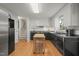 Functional kitchen with stainless steel appliances, hardwood floors, and ample cabinet space at 5523 Newberry Dr, Raleigh, NC 27609