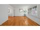 Bright living room with hardwood floors, large windows, and a smooth transition to other rooms at 5523 Newberry Dr, Raleigh, NC 27609