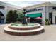 Charming town center featuring a tiered fountain, McAlister's Deli, and inviting outdoor seating at 5523 Newberry Dr, Raleigh, NC 27609
