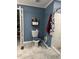 Cozy bathroom featuring a tiled shower, blue walls, toilet and a stylish toilet seat cover at 57 Winding Ridge Rdg, Sanford, NC 27332
