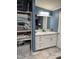 Bright bathroom featuring a granite countertop, white cabinets, and ample storage space at 57 Winding Ridge Rdg, Sanford, NC 27332