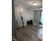 Bedroom with exercise equipment and hardwood floors, complemented by a window with natural light at 57 Winding Ridge Rdg, Sanford, NC 27332
