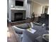Inviting living room featuring a stone fireplace and comfortable seating on modern wood floors at 57 Winding Ridge Rdg, Sanford, NC 27332