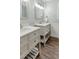 Bathroom features a dual sink vanity, hardwood floor, and nice countertops at 5809 N Hawthorne Way, Raleigh, NC 27603