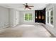 Large bonus room featuring a ceiling fan, two windows, and guitars on the wall at 5809 N Hawthorne Way, Raleigh, NC 27603