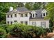 Charming two-story home with a black roof, gray shutters, and mature landscaping at 5809 N Hawthorne Way, Raleigh, NC 27603
