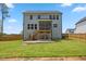 Large backyard with a screened-in deck, stairs, patio, and wooden fence at 70 Noble Heart Pl, Fuquay Varina, NC 27526