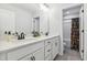 Pristine bathroom featuring a double vanity with a quartz countertop and modern fixtures at 70 Noble Heart Pl, Fuquay Varina, NC 27526