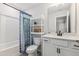 Cozy bathroom includes shower/tub combo with eye-catching curtain and white vanity storage at 70 Noble Heart Pl, Fuquay Varina, NC 27526