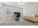 Clean bedroom featuring neutral walls, a comfortable bed, and a streamlined workspace area at 70 Noble Heart Pl, Fuquay Varina, NC 27526