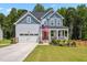 Charming two-story home with a welcoming front porch and attached two car garage at 70 Noble Heart Pl, Fuquay Varina, NC 27526