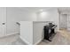 Upstairs hallway featuring a piano on the right and an entrance to another room on the left at 70 Noble Heart Pl, Fuquay Varina, NC 27526