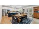 Open concept kitchen and dining area with modern cabinetry and stylish accents at 70 Noble Heart Pl, Fuquay Varina, NC 27526