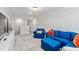 Relaxing living room with comfortable seating, bright pillows and a modern entertainment center at 70 Noble Heart Pl, Fuquay Varina, NC 27526
