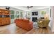 Inviting living room features a fireplace, large windows with wooded views, and comfortable seating at 70 Noble Heart Pl, Fuquay Varina, NC 27526