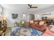 Spacious living room open to kitchen, featuring a cozy seating area with a fireplace at 70 Noble Heart Pl, Fuquay Varina, NC 27526