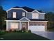 Charming two-story home with brick and siding, features a two-car garage and landscaped front yard at 760 Deschutes Dr, Garner, NC 27529
